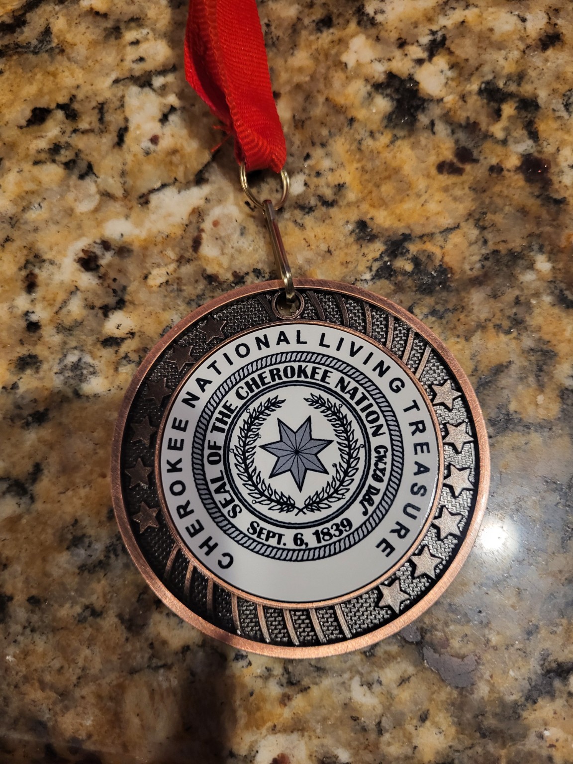 Joseph Price's Cherokee National Living Treasure medal, engraved Gadugi, Unity Through Generations, 2025